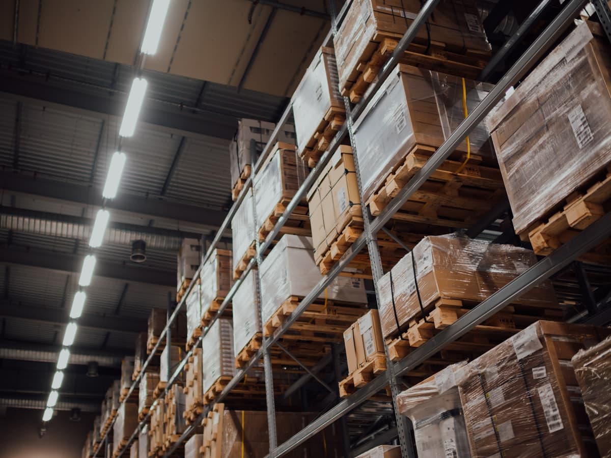 Racked warehouse storage between consolidation and loading.